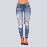 High Waist Jeans with Ripped Hips - The Woman Concept