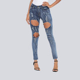 Jean skinny extensible à trous traversants 